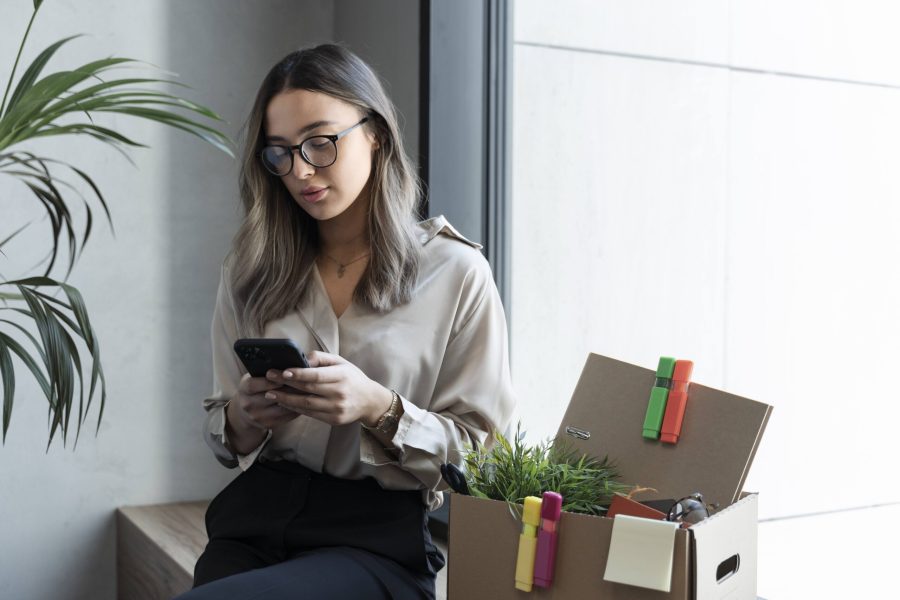 medium-shot-woman-holding-smartphone (3)
